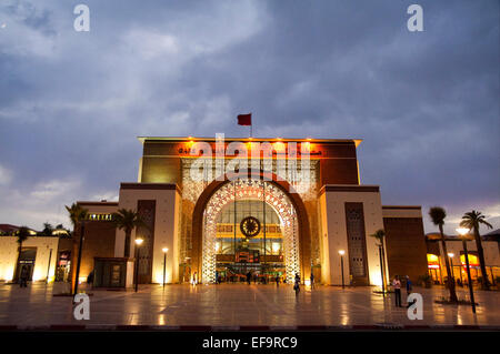 Horizontal streetscape of the railway station in Marrakech at dusk (with motion blur). Stock Photo