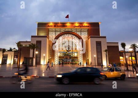 Horizontal streetscape of the railway station in Marrakech at dusk (with motion blur). Stock Photo