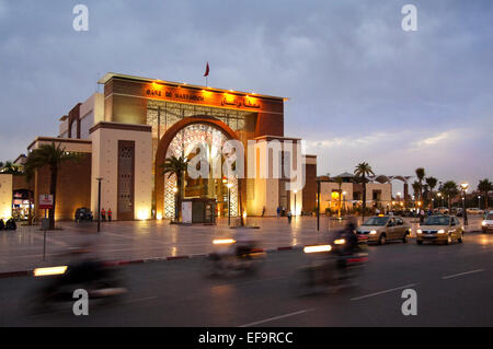 Horizontal streetscape of the railway station in Marrakech at dusk (with motion blur). Stock Photo