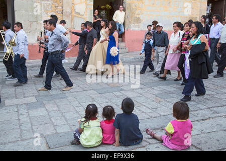 Oaxaca, Mexico - Children watch a quinceañera celebration. Stock Photo