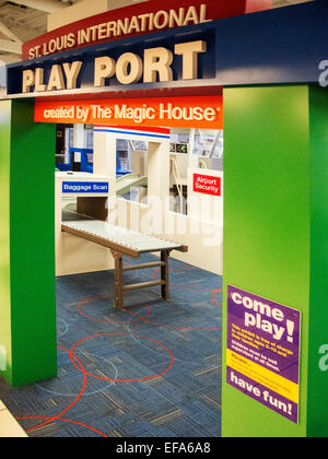 Lambert-St.Louis Airport features a 1,500-square-foot  'Play Port' where children waiting for a flight can work off some of their energy. It includes a child-sized plane, an air traffic control tower with a slide, car rental counters, a luggage conveyor belt and an airport screening area with a pretend x-ray machine. Stock Photo