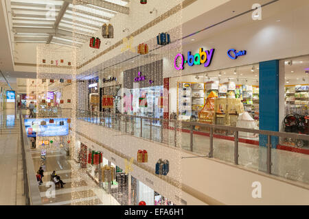 Interior of Dubai Outlet Mall. The shopping mall is part of Dubai Outlet City in Dubai, UAE Stock Photo
