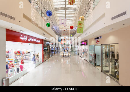 Interior of Dubai Outlet Mall. The shopping mall is part of Dubai Outlet City in Dubai Stock Photo