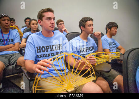 Students at California State University Fullerton School of Engineering hold bridges made from spaghetti at a competition to pick the strongest one sponsored by Johns Hopkins University. Note T-shirts. Stock Photo