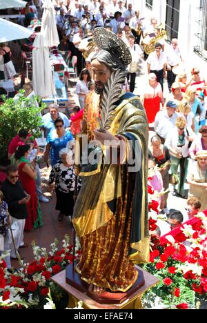 Statue of Saint Bernard on a float being carried through the town streets during the Romeria San Bernabe, Marbella, Spain. Stock Photo