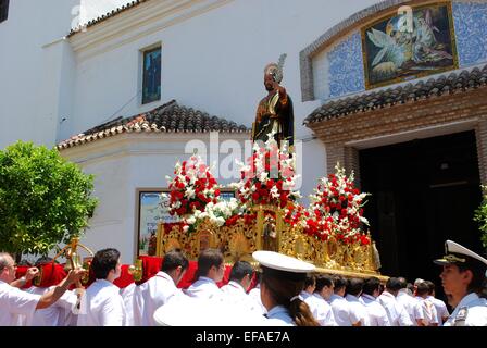 Statue of Saint Bernard on the float being carried into the church at the Romeria San Bernabe, Marbella, Costa del Sol, Spain. Stock Photo