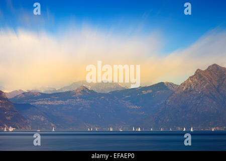 Many boats sailing on the lake during a sunny day for a regatta, Iseo, Italy Stock Photo