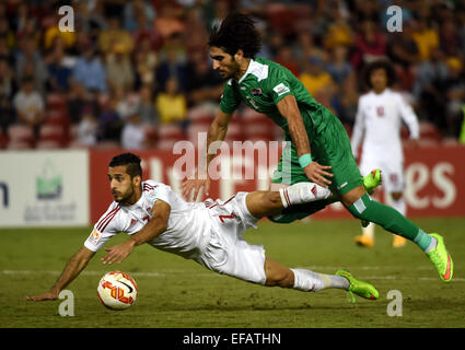 Newcastle, Australia. 30th Jan, 2015. Ahmed Ibrahim (top) of Iraq fouls against Ali Ahmed Mabkhout of the United Arab Emirates during the third and fourth final match at the 2015 AFC Asian Cup in Newcastle, Australia, Jan. 30, 2015. The United Arab Emirates won 3-2. Credit:  Guo Yong/Xinhua/Alamy Live News Stock Photo