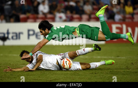 Newcastle, Australia. 30th Jan, 2015. Ahmed Ibrahim (top) of Iraq fouls against Ali Ahmed Mabkhout of the United Arab Emirates during the third and fourth final match at the 2015 AFC Asian Cup in Newcastle, Australia, Jan. 30, 2015. The United Arab Emirates won 3-2. Credit:  Guo Yong/Xinhua/Alamy Live News Stock Photo