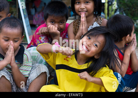 Children having fun in Koh Lanta. Krabi. Thailand. Asia. Ko Lanta is technically called Ko Lanta Yai, the largest of 52 islands Stock Photo
