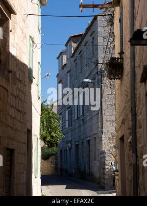 Stone streets and old stone building exteriors on island Vis in Croatia Stock Photo