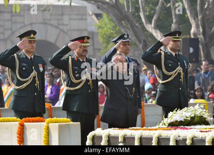 New Delhi, India. 30th January, 2015. Mahatma Gandhi on his death anniversary in 2015. Indian President Pranab Mukherjee (C front) pays his respect at Rajghat, a memorial of Mahatma Gandhi on his death anniversary in India on Jan. 30, 2015. Gandhi was assassinated on January 30, 1948, while he was walking to a platform from which he was to address a prayer meeting. Credit:  Partha Sarkar/Xinhua/Alamy Live News Stock Photo