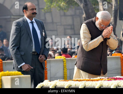 New Delhi, India. 30th January, 2015. 1948. Indian Prime Minister Narendra Modi (R) pays his respect at Rajghat at the memorial of Mahatma Gandhi on his death anniversary in India on Jan. 30, 2015. Gandhi was assassinated on January 30, 1948, while he was walking to a platform from which he was to address a prayer meeting. Credit:  Partha Sarkar/Xinhua/Alamy Live News Stock Photo