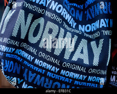Blue touristy bag with Norway written in in many sizes, close up of souvenir for sale in Oslo Stock Photo