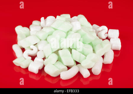 Pile of green and white packing foam strips Stock Photo