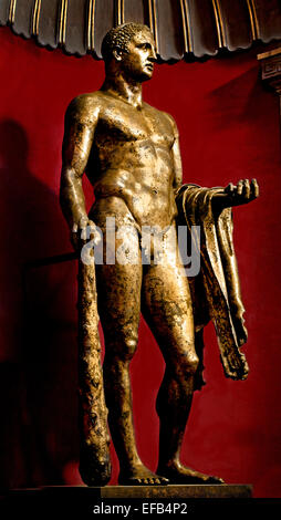 Heracles ( divine hero in Greek mythology, ) with club, lion skin and golden apples. The statue was found neatly buried under tiles with the inscription “FCS” (“fulgor conditum summanium”), indicating that it was struck by lightning then buried on the spot. Gilt bronze, Roman artwork of the 2nd century AD  ( Vatican Museum Rome Italy ) Stock Photo