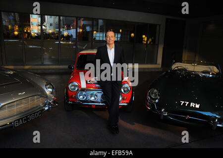 London, UK. 30th Jan, 2015. Presenter Quentin Wilson  launches the Channel 5 Classic Car Show with ith cars from the show including a Jaguar E-type and Aston Martin DB5 at the Soho Hotel. Stock Photo