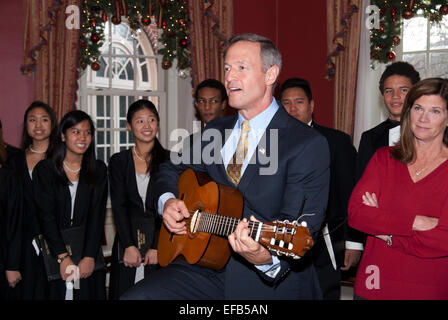 Governor of Maryland Martin O'Malley plays the guitar during an open house at the Governors Residence December 13, 2014 in Annapolis, Maryland. Stock Photo