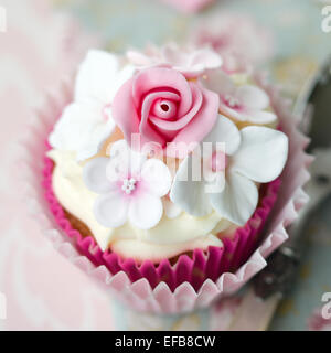 Cupcake decorated with fondant flowers Stock Photo