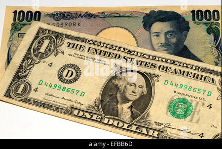 Japanese Yen and USA Dollar Bank Notes Stock Photo