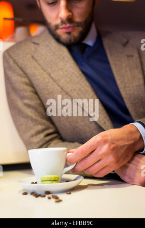 Business man in coffee shop, drinking espresso Stock Photo