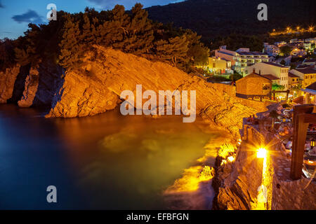 Night scene with cliff on the Adriatic sea coast in Petrovac, Montenegro. Stock Photo