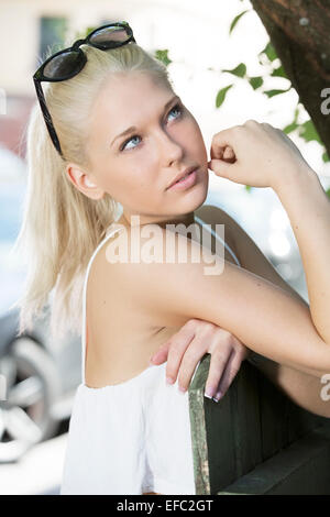 Blonde girl model with sunglesses outdoor Stock Photo