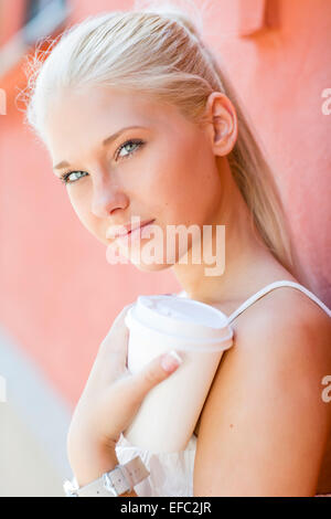 Natural and pretty teenage girl drinking coffee Stock Photo