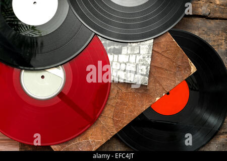 Old vinyl long play records on vintage wooden background Stock Photo