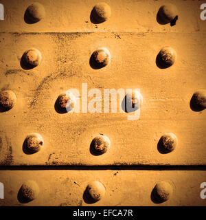 Metal surface with rivets, may be used as background Stock Photo
