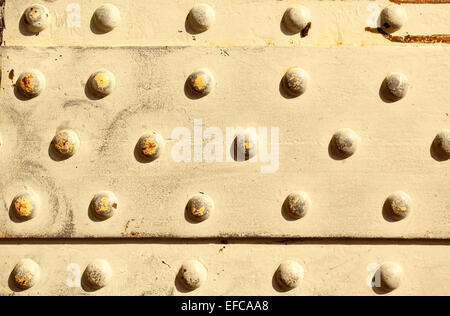 Metal surface with rivets, may be used as background Stock Photo