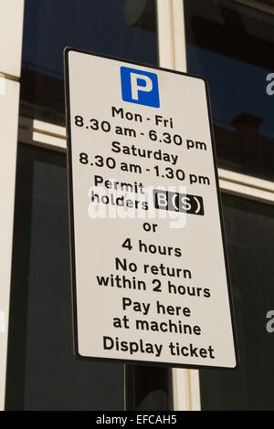 Confusing parking sign in central London, showing restrictions Monday to Friday and Saturday Stock Photo
