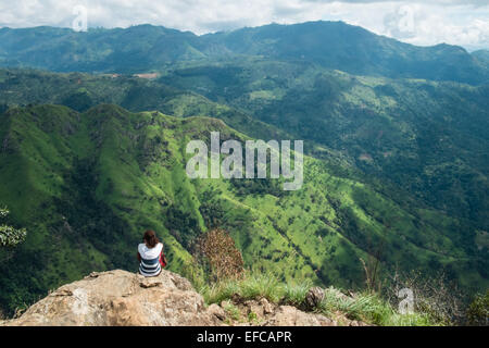 Tourists on summit and view from Adam's Peak.green scenery.Hill,mount,mountain.Ella Gap. Stock Photo
