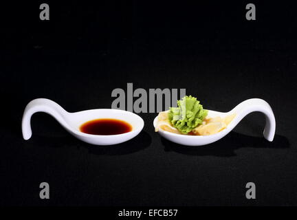 Wasabi and soy sauce on black background, horizontal Stock Photo