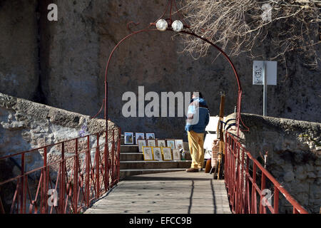 Bridge in Cuenca, Spain man selling paintings Stock Photo