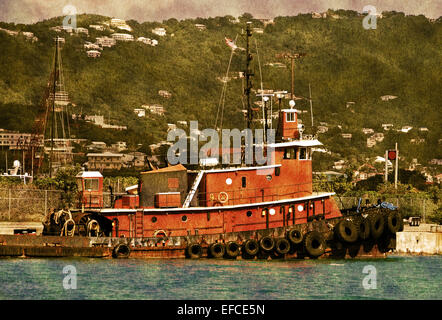 Old tug boat in Caribbean port Stock Photo