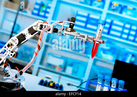 robot manipulates chemical tubes in the laboratory Stock Photo