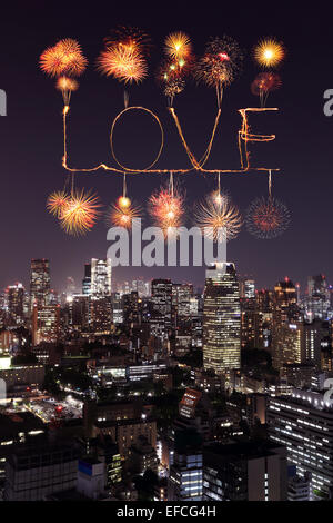 Love sparkle Fireworks celebrating over Tokyo cityscape at night, Japan Stock Photo