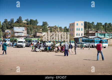People wait for a bus during a local ceasefire related to evacuation ...