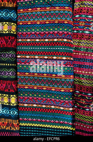 Beautiful colors and intricate geometrical designs identify the fabrics handwoven by Mayan women in the highlands of Guatemala. Stock Photo