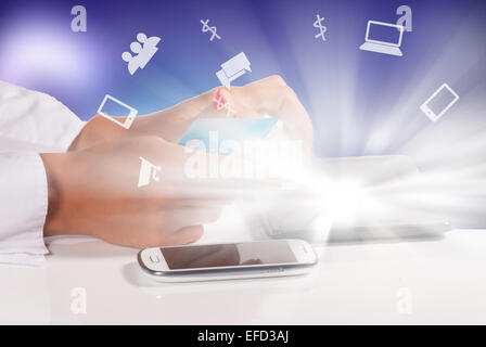 Woman holding credit card and writing on keyboard Stock Photo