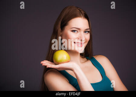 https://l450v.alamy.com/450v/efd4jf/woman-holding-apple-efd4jf.jpg