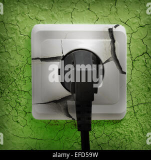 Wall plug socket on cracked colored wall background Stock Photo