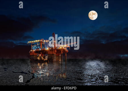 Oil Rig at night in winter scenery. Stock Photo