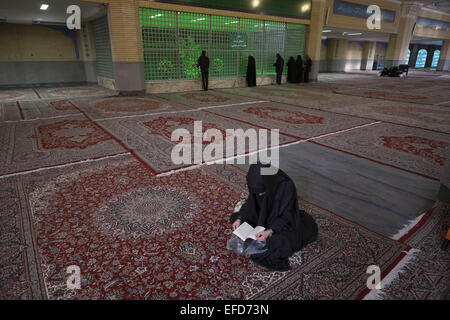 Tehran, Iran. 1st Feb, 2015. February 1, 2015 - Tehran, Iran - An Iranian woman prays as she sit at the tomb of Iran's Late Leader Ayatollah RUHOLLAH KHOMEINI in southern Tehran before the beginning of a ceremony marking the anniversary of the Islamic Revolution. Morteza Nikoubazl/ZUMAPRESS Credit:  Morteza Nikoubazl/ZUMA Wire/Alamy Live News Stock Photo