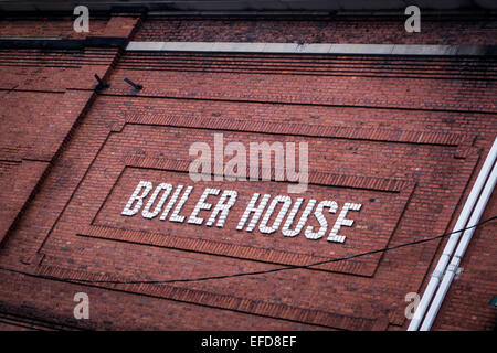 A red brick wall with the words "boiler house" written in white brick on the side of the building.  Brownsville, Pennsylvania, U Stock Photo