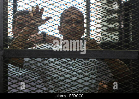 Cairo, Egypt. Egypt has decided to deport jailed reporter Peter Greste to his native Australia. 1st Feb, 2015. File photo taken on June 23, 2014 shows Al-Jazeera's Australian journalist Peter Greste standing behind bars as he listened to the verdict at a court in Cairo, Egypt. Egypt has decided to deport jailed reporter Peter Greste to his native Australia, Egypt's state news agency reported on Sunday Feb. 1, 2015. Credit:  Cui Xinyu/Xinhua/Alamy Live News Stock Photo