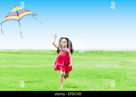 1 indian child girl park Kite Flying Stock Photo