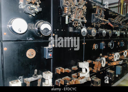 Very old electrical switchgear with gauges and Edison style knife switches Stock Photo