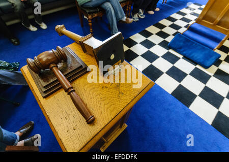 Gavel and a knocked over column inside a Freemason's blue 'Craft Lodge' room. Stock Photo
